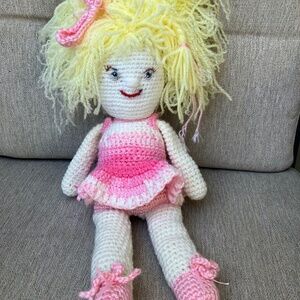 Crochet stuff toy. Yellow hair ballerina pink dress and shoes.